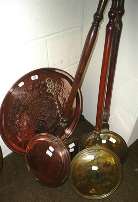 Lot 347 - Three warming pans, copper charger and a brass chestnut roaster (5)