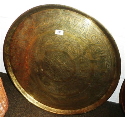 Lot 348 - A large brass tray with chased decoration