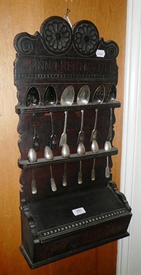 Lot 350 - A 19th century carved oak spoon rack and a display of spoons