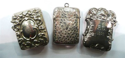 Lot 365 - Two silver vesta cases and a plated example