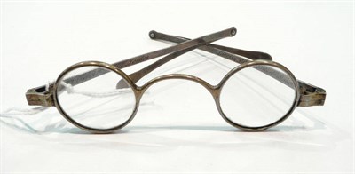 Lot 366 - A pair of George III silver-framed spectacles by Bradberry Patent Spectacle Maker 332, Oxford...