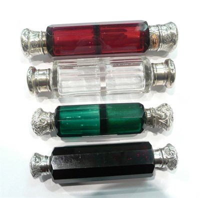 Lot 367 - A green glass double ended scent bottle, two ruby glass examples and a clear glass example (4)