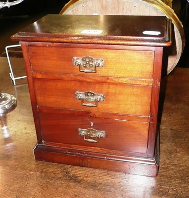 Lot 429 - A Victorian walnut miniature chest of three drawers