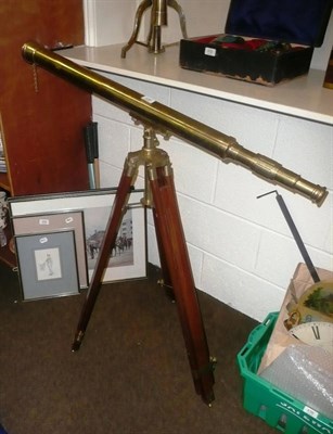 Lot 435 - A brass telescope on tripod