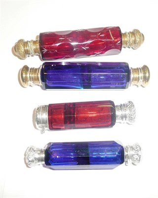 Lot 454 - Two ruby glass double ended scent bottles and two blue glass examples (4)