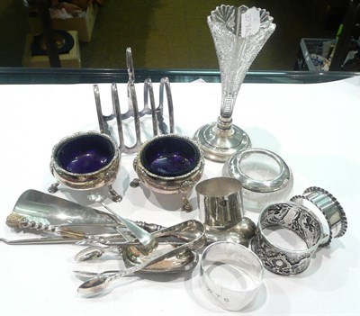 Lot 459 - Two salts, two napkin rings, tongs, spoons etc (quantity)