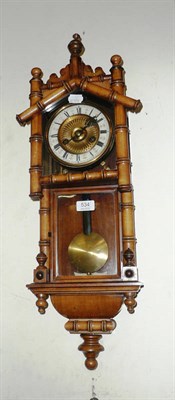 Lot 534 - A Vienna style wall clock in a faux bamboo case