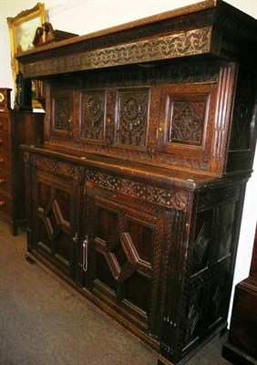 Lot 538 - Carved oak press cupboard