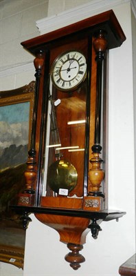 Lot 542 - A walnut cased Vienna style wall clock with brass grid iron pendulum