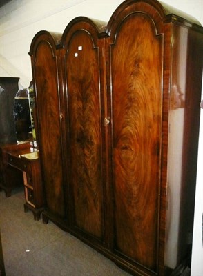 Lot 548 - A mahogany triple wardrobe and a dressing table