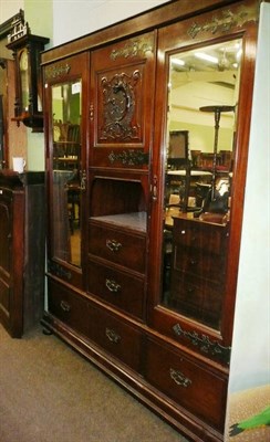 Lot 555 - Victorian triple wardrobe