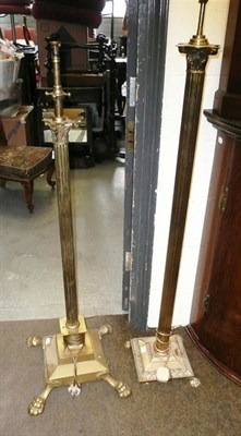 Lot 560 - Two brass floor standard lamps