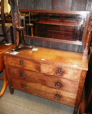 Lot 574 - An Arts & Crafts oak dressing table with carved lion finials