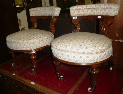 Lot 578 - A pair of Victorian walnut nursing chairs