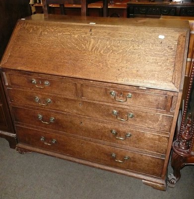 Lot 582 - A Georgian oak bureau