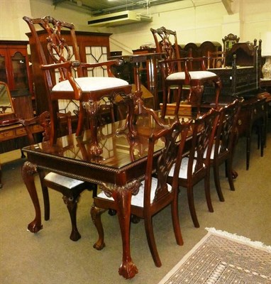 Lot 587 - A Chippendale style mahogany dining table and eight chairs (6+2)