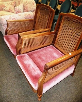 Lot 627 - A pair of bergere armchairs