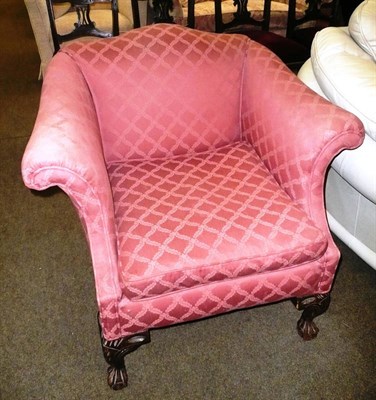 Lot 631 - An armchair upholstered in red diapered weave