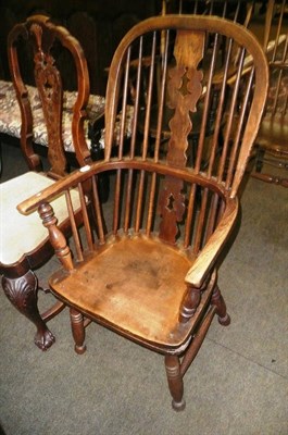 Lot 640 - A 19th century ash Windsor armchair (cut down)