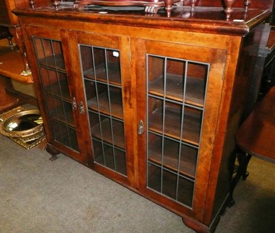 Lot 663 - A leaded glazed walnut bookcase