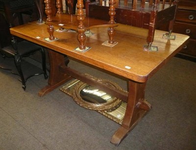 Lot 668 - An oak 'Gnomeman' trestle table