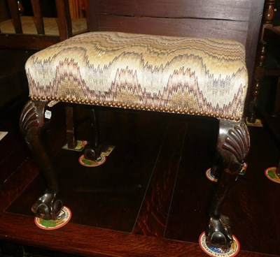 Lot 671 - A Georgian style dressing stool on claw and ball feet