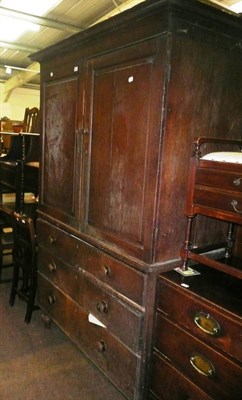 Lot 673 - A 19th century oak cabinet on chest