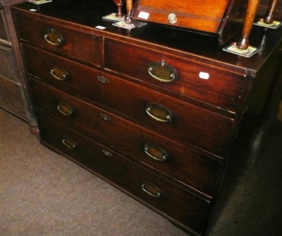 Lot 675 - A George III mahogany four height chest of drawers (feet missing)