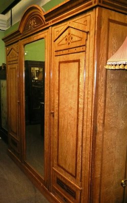 Lot 680 - Large ash triple wardrobe (cornice damaged)