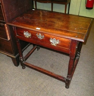 Lot 687 - An early 18th century fruitwood lowboy