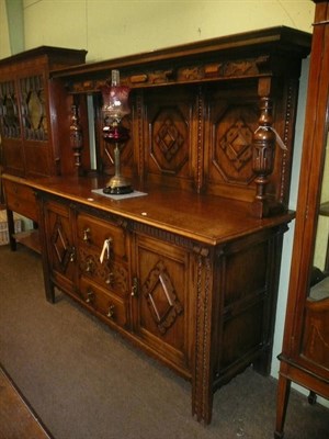 Lot 698 - A large oak sideboard with panelled super structure