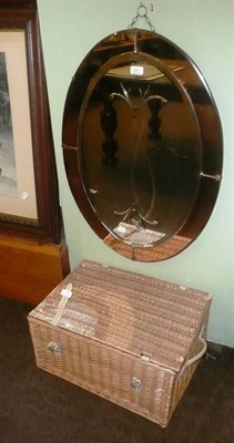 Lot 701 - An Art Deco wall mirror and a fitted wicker hamper