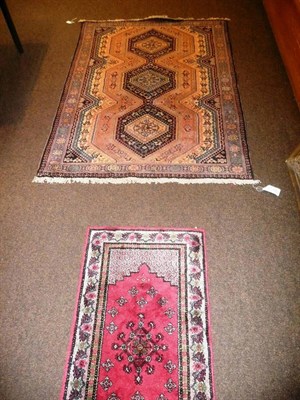 Lot 702 - Iranian blue ground geometric patterned rug and a red prayer mat