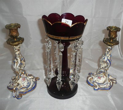 Lot 21 - Ruby lustre with glass drops and a pair of candlesticks
