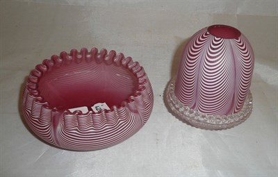 Lot 24 - A red Nailsea night light holder and matching base