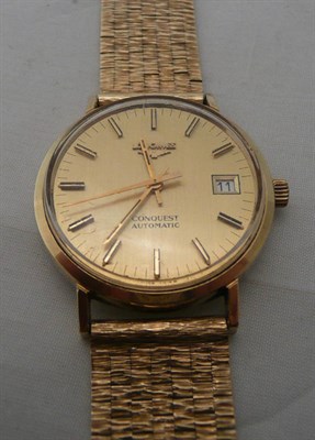 Lot 61 - A steel and gilt Longines Conquest wristwatch with a bracelet stamped '375'