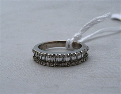 Lot 102 - A diamond three-row ring