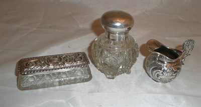 Lot 105 - Cut glass scent bottle with silver cover, small Continental silver cream jug and a glass pin...