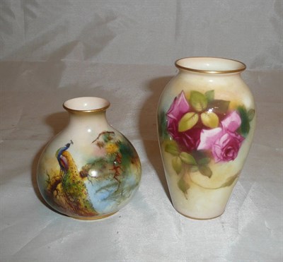 Lot 106 - Royal Worcester peacock decorated squat vase and another decorated with roses (2)