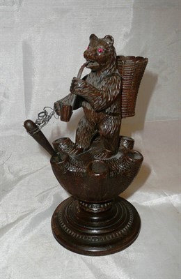 Lot 111 - A Bavarian carved bear pipe holder