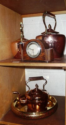 Lot 137 - Three copper kettles, an Eastern bowl and a small oak mantel clock