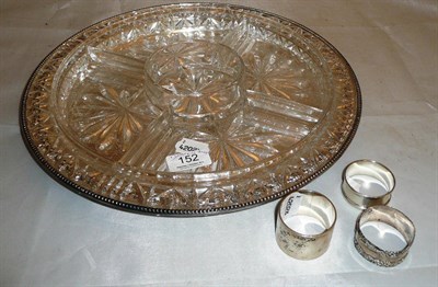 Lot 152 - Three silver napkin rings, plate and glass hors d'oeuvre's dish