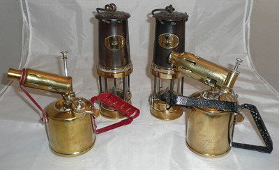 Lot 156 - Two miner's lamps and two brass blow lamps