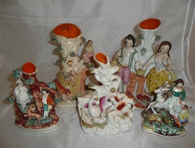 Lot 194 - Five small Staffordshire spill vase figural groups