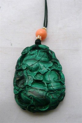 Lot 217 - Chinese carved malachite pendant on necklet