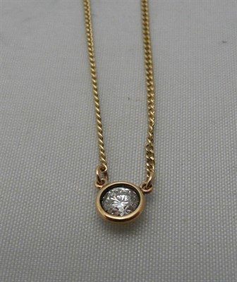 Lot 228 - A diamond pendant on curb chain