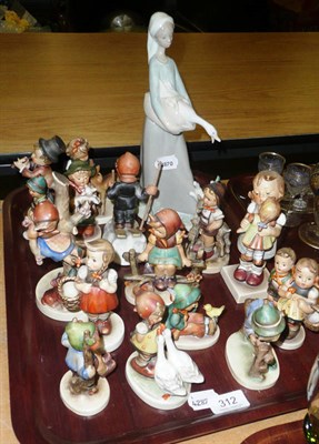 Lot 312 - Fifteen Hummel figures and a Lladro figure