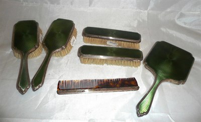 Lot 324 - A silver and enamel five piece dressing table set and a hair comb