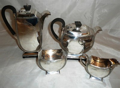 Lot 337 - A George VI four piece tea service by Walker & Hall, Sheffield 1947, in Art Deco style -...