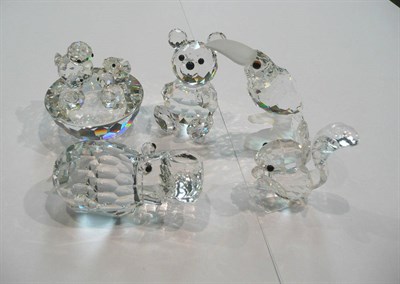 Lot 379 - Five Swarovski crystal small animal figures including a squirrel, macaw, hippo, teddy bear,...